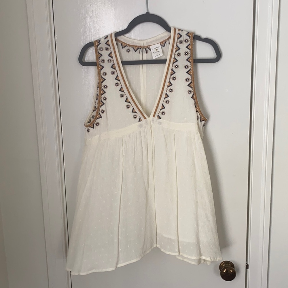 Cream stitched v neck top